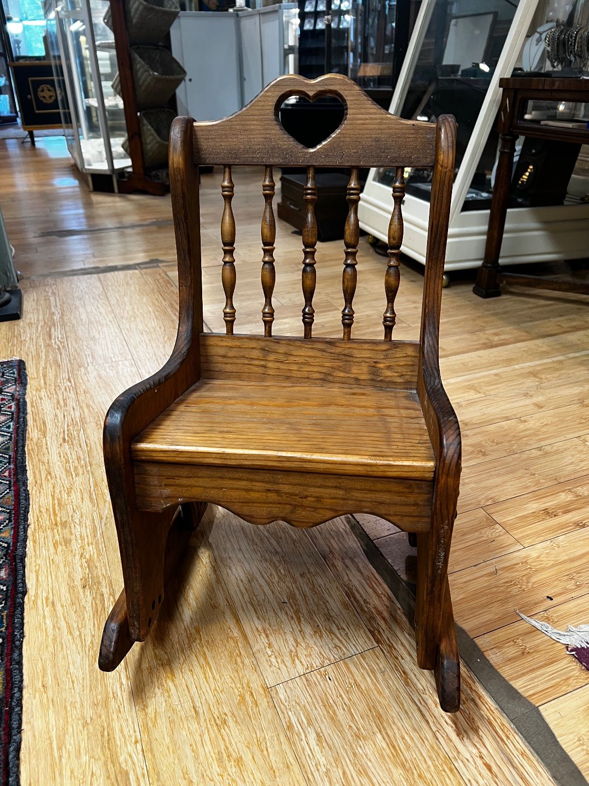 Vintage Oak Child's Rocking Chair with Heart Cutout Spindle Back