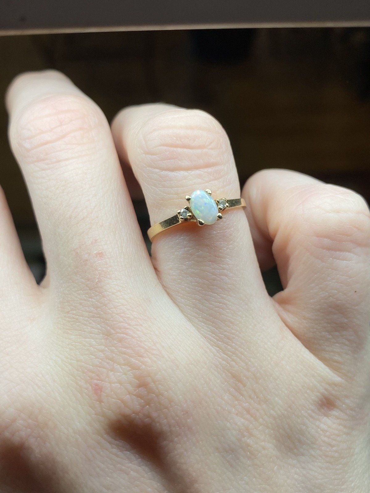 Minimalistic 10k Gold Oval Opal Diamond Flanked Ring 7