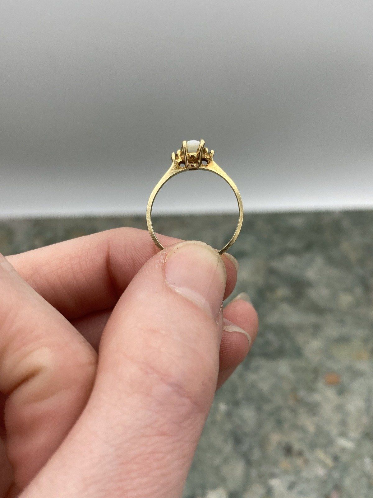 Minimalistic 10k Gold Oval Opal Diamond Flanked Ring 9